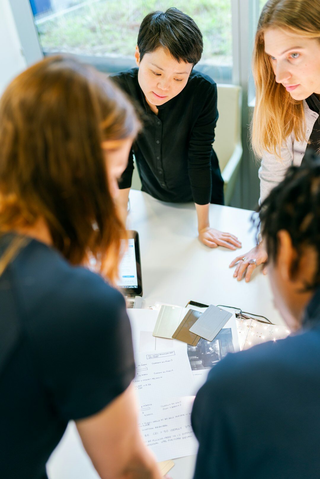 group of people analyzing charts